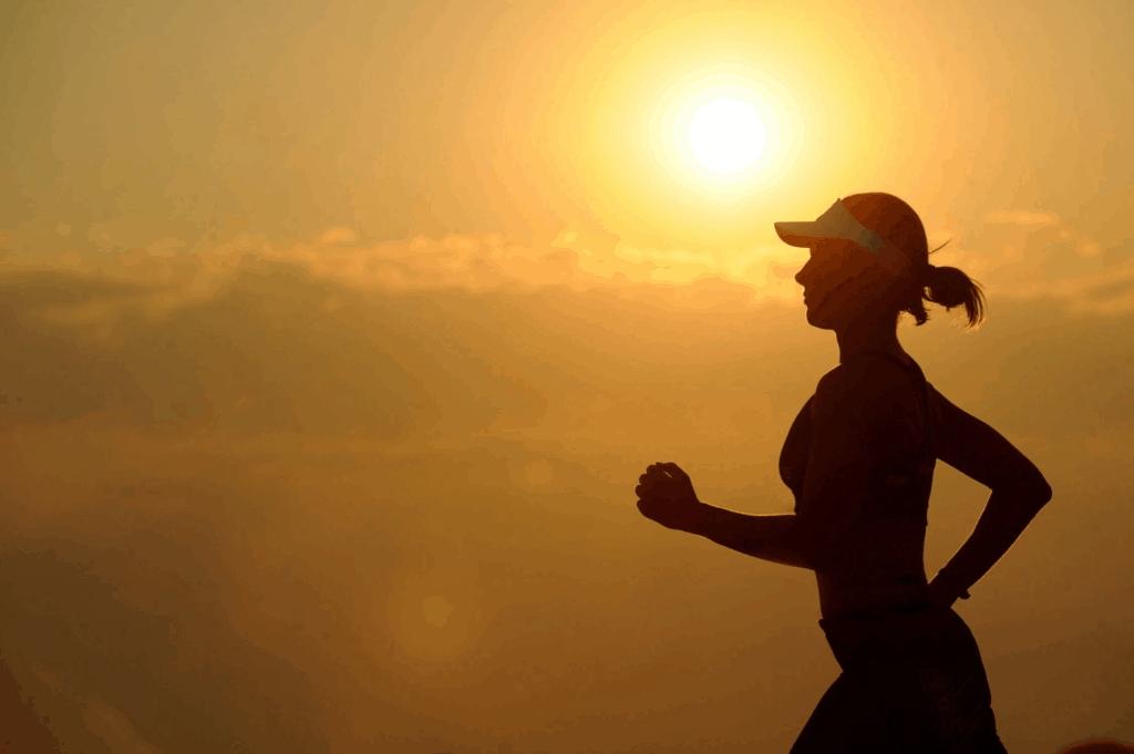 Woman running and enjoying the positive hemp oil side effects